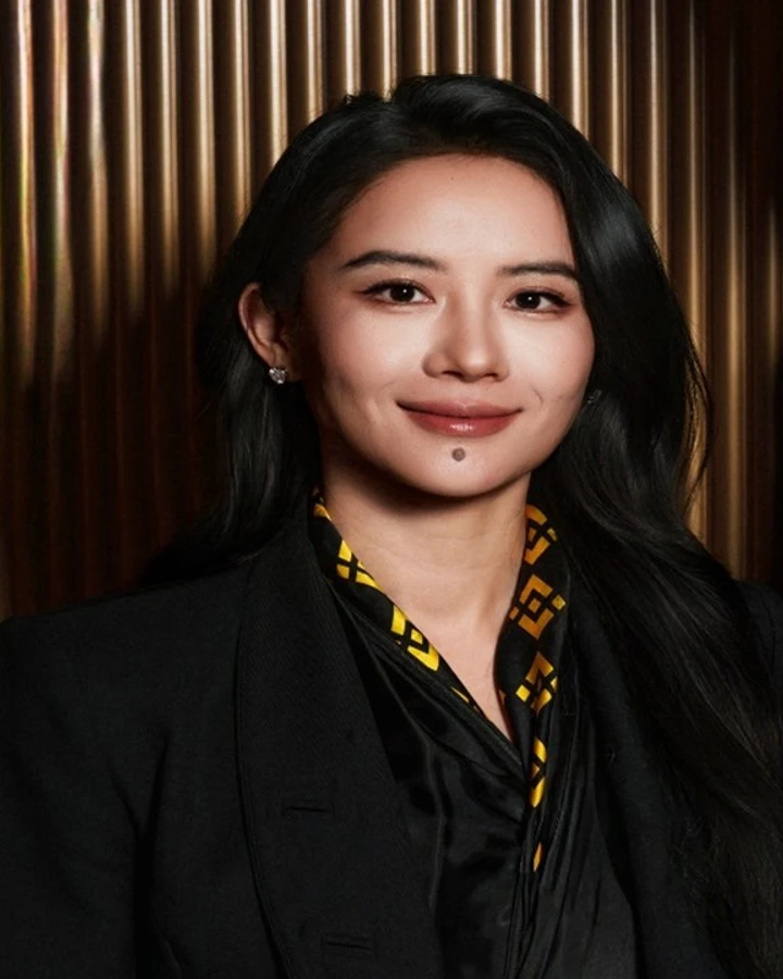 Yi He, cropped from a Binance photograph with Richard Teng